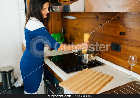 To use this stock image in your creative project, please select the size you need over to the right and click the "Add to Cart" button.
Your downloaded image will come with the Cutcaster watermark removed so don’t worry about the watermark you see on this page. Italian Food On The Menu stock photo, Attractive Mother In Blue Dress Preparing Spaghetti’s For the Dinner in the Kitchen by Vera Arsic
