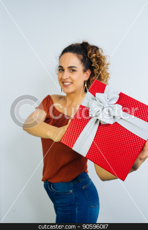 To use this stock image in your creative project, please select the size you need over to the right and click the "Add to Cart" button.
Your downloaded image will come with the Cutcaster watermark removed so don’t worry about the watermark you see on this page. Happy Valentines Day stock photo, Attractive Curly Long Haired Woman Is Holding A Gift Box With Ribbon Isolated On White Background by Vera Arsic