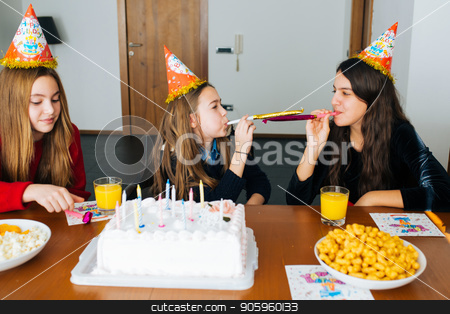 To use this stock image in your creative project, please select the size you need over to the right and click the "Add to Cart" button.
Your downloaded image will come with the Cutcaster watermark removed so don’t worry about the watermark you see on this page. Children at birthday party stock photo, Group of kids celebrate birthday together and blowing in the whistles by Vera Arsic