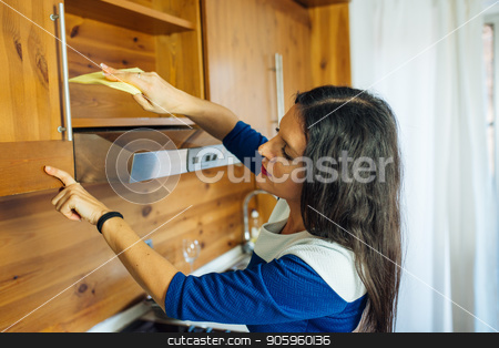 To use this stock image in your creative project, please select the size you need over to the right and click the "Add to Cart" button.
Your downloaded image will come with the Cutcaster watermark removed so don’t worry about the watermark you see on this page. Woman in the Kitchen stock photo, Attractive Long Haired Woman In Blue Dress Is Polishing The Kitchen With Yellow Rag by Vera Arsic