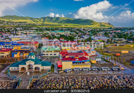 To use this stock image in your creative project, please select the size you need over to the right and click the "Add to Cart" button.
Your downloaded image will come with the Cutcaster watermark removed so don’t worry about the watermark you see on this page. Colorful Town and Green Hills stock photo, A colorful town on the coast of St Kitts with green hills behind by Darryl Brooks