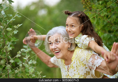 To use this stock image in your creative project, please select the size you need over to the right and click the "Add to Cart" button.
Your downloaded image will come with the Cutcaster watermark removed so don’t worry about the watermark you see on this page. Portrait of grandmother and granddaughter stock photo, Portrait of grandmother and granddaughter in summer park by Ruslan Huzau