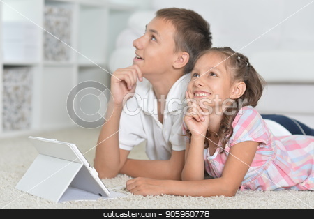 To use this stock image in your creative project, please select the size you need over to the right and click the "Add to Cart" button.
Your downloaded image will come with the Cutcaster watermark removed so don’t worry about the watermark you see on this page. Beautiful boy and girl with tablet pc stock photo, Portrait of beautiful boy and girl with tablet pc by Ruslan Huzau