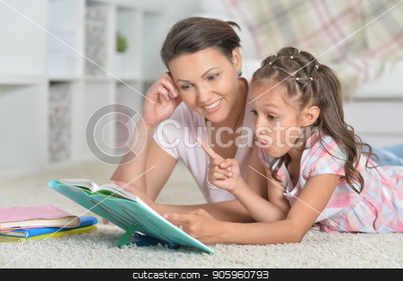 To use this stock image in your creative project, please select the size you need over to the right and click the "Add to Cart" button.
Your downloaded image will come with the Cutcaster watermark removed so don’t worry about the watermark you see on this page. Mother with daughter doing homework stock photo, Close-up portrait of mother with daughter doing homework by Ruslan Huzau