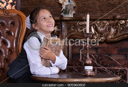 To use this stock image in your creative project, please select the size you need over to the right and click the "Add to Cart" button.
Your downloaded image will come with the Cutcaster watermark removed so don’t worry about the watermark you see on this page. little girl reading book stock photo, Cute little girl in school uniform holding book in room with vintage furniture by Ruslan Huzau