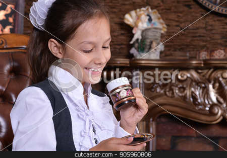 To use this stock image in your creative project, please select the size you need over to the right and click the "Add to Cart" button.
Your downloaded image will come with the Cutcaster watermark removed so don’t worry about the watermark you see on this page. Girl drinking tea stock photo, Portrait of schoolgirl drinking tea in room with vintage interior by Ruslan Huzau