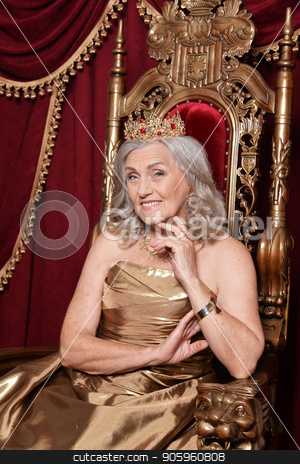 To use this stock image in your creative project, please select the size you need over to the right and click the "Add to Cart" button.
Your downloaded image will come with the Cutcaster watermark removed so don’t worry about the watermark you see on this page. senior woman sitting in vintage chair stock photo, Beautiful senior woman in golden dress with crown sitting in vintage chair by Ruslan Huzau