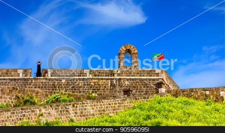 To use this stock image in your creative project, please select the size you need over to the right and click the "Add to Cart" button.
Your downloaded image will come with the Cutcaster watermark removed so don’t worry about the watermark you see on this page. Fortress and Cannon Against Sky stock photo, Part of an old fortress in the tropics by Darryl Brooks
