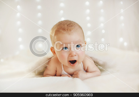 To use this stock image in your creative project, please select the size you need over to the right and click the "Add to Cart" button.
Your downloaded image will come with the Cutcaster watermark removed so don’t worry about the watermark you see on this page. a blue-eyed boy with his mouth open is lying on his stomach on a white background with wings behind his back. Angel Cupid looks up stock photo, a blue-eyed boy with his mouth open is lying on his stomach on a white background with wings behind his back. Angel Cupid looks up by aaalll3110