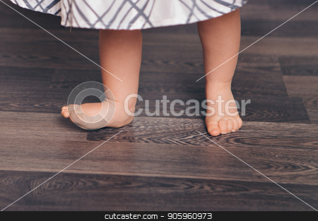 To use this stock image in your creative project, please select the size you need over to the right and click the "Add to Cart" button.
Your downloaded image will come with the Cutcaster watermark removed so don’t worry about the watermark you see on this page. Cropped photo: barefoot child standing on the floor. The first steps in close-up. Healthy baby feet stock photo, Cropped photo: barefoot child standing on the floor. The first steps in close-up. Healthy baby feet by aaalll3110