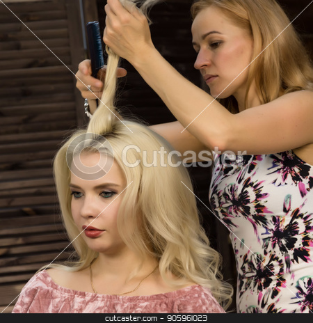 To use this stock image in your creative project, please select the size you need over to the right and click the "Add to Cart" button.
Your downloaded image will come with the Cutcaster watermark removed so don’t worry about the watermark you see on this page. Hairdresser does hairstyle for luxurious blond woman. coiffure in the form of big curl. Concept wedding hairstyle stock photo, Hairdresser does hairstyle for luxurious blond woman. coiffure in the form of big curl. Concept wedding hairstyle. by Alexander