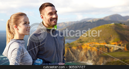 To use this stock image in your creative project, please select the size you need over to the right and click the "Add to Cart" button.
Your downloaded image will come with the Cutcaster watermark removed so don’t worry about the watermark you see on this page. couple of sportsmen with water over big sur coast stock photo, fitness, sport and people concept - smiling couple with bottles of water over bixby creek bridge on big sur coast of california background by Syda Productions