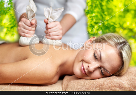 Close Up Of Woman Having Herbal Bag Massage In Spa Stock Photo