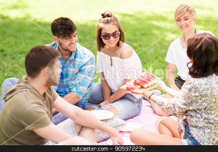 To use this stock image in your creative project, please select the size you need over to the right and click the "Add to Cart" button.
Your downloaded image will come with the Cutcaster watermark removed so don’t worry about the watermark you see on this page. happy friends eating watermelon at summer picnic stock photo, friendship, leisure and summer concept - group of happy friends eating watermelon at picnic in park by Syda Productions
