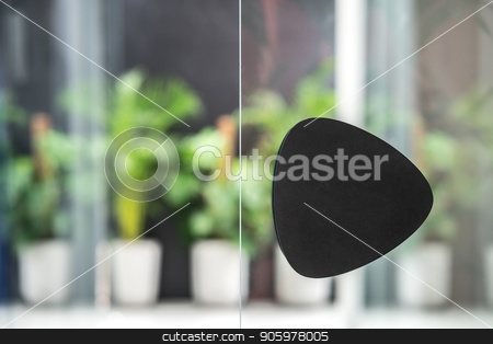 To use this stock image in your creative project, please select the size you need over to the right and click the "Add to Cart" button.
Your downloaded image will come with the Cutcaster watermark removed so don’t worry about the watermark you see on this page. Black handle on glass door in luminous interior stock photo, Closeup low aperture photo of the glass door with a black handle on the background of the green plants in the big pots. Horizontal. by bezikus