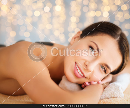 To use this stock image in your creative project, please select the size you need over to the right and click the "Add to Cart" button.
Your downloaded image will come with the Cutcaster watermark removed so don’t worry about the watermark you see on this page. beautiful woman having hot stone therapy at spa stock photo, wellness, spa and beauty concept - beautiful woman having hot stone therapy over holidays lights background by Syda Productions