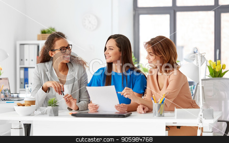 To use this stock image in your creative project, please select the size you need over to the right and click the "Add to Cart" button.
Your downloaded image will come with the Cutcaster watermark removed so don’t worry about the watermark you see on this page. businesswomen discussing papers at office stock photo, business, teamwork and people concept - female team or businesswomen discussing papers at office by Syda Productions