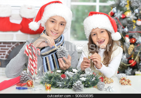To use this stock image in your creative project, please select the size you need over to the right and click the "Add to Cart" button.
Your downloaded image will come with the Cutcaster watermark removed so don’t worry about the watermark you see on this page. Happy brother and sister in Santa hats preparing for Christmas stock photo, Portrait of happy brother and sister in Santa hats preparing for Christmas by Ruslan Huzau