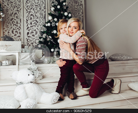 To use this stock image in your creative project, please select the size you need over to the right and click the "Add to Cart" button.
Your downloaded image will come with the Cutcaster watermark removed so don’t worry about the watermark you see on this page. Mother and child hugging white teddy bear and posing stock photo, Front view of cute family sitting together on stairs, looking at camera and smiling at christmas. Beautiful mother and child hugging big white teddy bear. Concept of new year atmosphere. by studiolucky