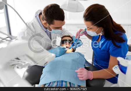 To use this stock image in your creative project, please select the size you need over to the right and click the "Add to Cart" button.
Your downloaded image will come with the Cutcaster watermark removed so don’t worry about the watermark you see on this page. dentist treating kid teeth at dental clinic stock photo, medicine, dentistry and healthcare concept - dentist and assistant with dental drill and saliva ejector treating kid patient teeth at dental clinic by Syda Productions
