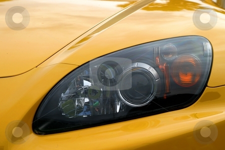 To use this stock image in your creative project, please select the size you need over to the right and click the "Add to Cart" button.
Your downloaded image will come with the Cutcaster watermark removed so don’t worry about the watermark you see on this page. Headlight Of A Car stock photo, Head light of a yellow sports car by Henrik Lehnerer
