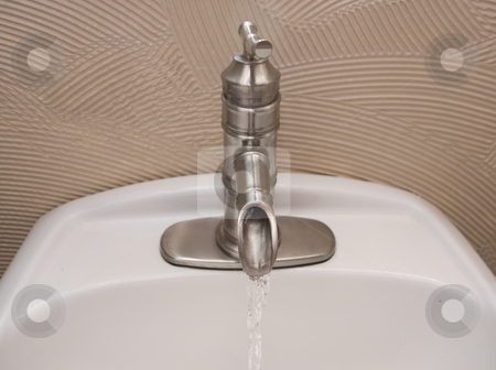 To use this stock image in your creative project, please select the size you need over to the right and click the "Add to Cart" button.
Your downloaded image will come with the Cutcaster watermark removed so don’t worry about the watermark you see on this page. Bath faucet with running water stock photo, Bath faucet with running water stainless steel by John Teeter