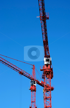 To use this stock image in your creative project, please select the size you need over to the right and click the "Add to Cart" button.
Your downloaded image will come with the Cutcaster watermark removed so don’t worry about the watermark you see on this page. Cranes working stock photo, Two cranes working high above city by Paul Phillips