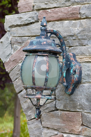To use this stock image in your creative project, please select the size you need over to the right and click the "Add to Cart" button.
Your downloaded image will come with the Cutcaster watermark removed so don’t worry about the watermark you see on this page. Old Lantern stock photo, Old lantern hooked on a stone wall by Jean Larue-Frechette