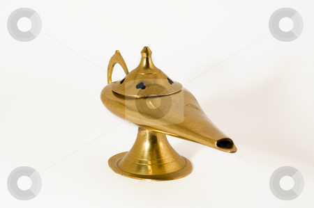 To use this stock image in your creative project, please select the size you need over to the right and click the "Add to Cart" button.
Your downloaded image will come with the Cutcaster watermark removed so don’t worry about the watermark you see on this page. Magic Lamp 45 angle stock photo, A Magic lamp shaped incense burner by Jean Larue-Frechette