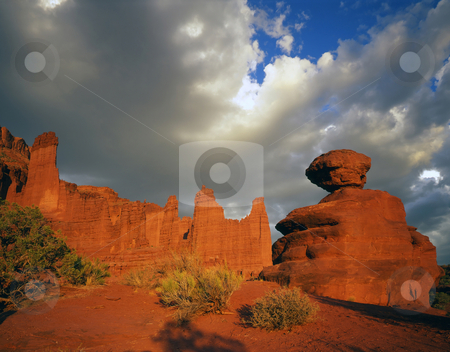 To use this stock image in your creative project, please select the size you need over to the right and click the "Add to Cart" button.
Your downloaded image will come with the Cutcaster watermark removed so don’t worry about the watermark you see on this page. Fisher Towers and Boulder stock photo, The Fisher Towers and a balanced boulder in Utah. by Mike Norton