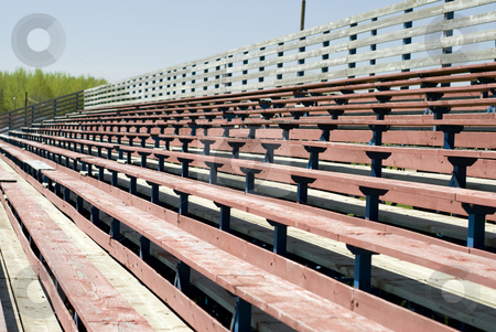 To use this stock image in your creative project, please select the size you need over to the right and click the "Add to Cart" button.
Your downloaded image will come with the Cutcaster watermark removed so don’t worry about the watermark you see on this page. Wooden Benches stock photo, An empty set of school benches, used for watching sporting events by Richard Nelson