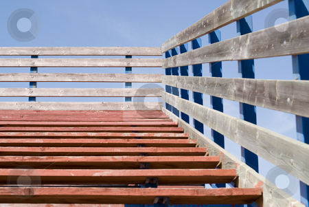 To use this stock image in your creative project, please select the size you need over to the right and click the "Add to Cart" button.
Your downloaded image will come with the Cutcaster watermark removed so don’t worry about the watermark you see on this page. School Bleachers stock photo, A set of wooden bleaches shot from at the bottom by Richard Nelson