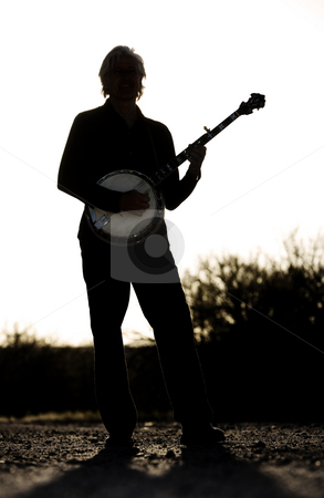 To use this stock image in your creative project, please select the size you need over to the right and click the "Add to Cart" button.
Your downloaded image will come with the Cutcaster watermark removed so don’t worry about the watermark you see on this page. Banjo Player stock photo, Banjo player with his instrument in silhouette by Scott Griessel