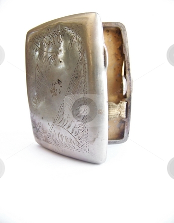 To use this stock image in your creative project, please select the size you need over to the right and click the "Add to Cart" button.
Your downloaded image will come with the Cutcaster watermark removed so don’t worry about the watermark you see on this page. Antique Cigarette Case, Open stock photo, Image of an antique metal cigartte case, standing up and open. Vertical orientation. by Jill Oliver