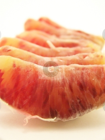 To use this stock image in your creative project, please select the size you need over to the right and click the "Add to Cart" button.
Your downloaded image will come with the Cutcaster watermark removed so don’t worry about the watermark you see on this page. Blood Oranges stock photo, Image of a peeled blood orange, segments lined up in a row. Vertical orientation. by Jill Oliver