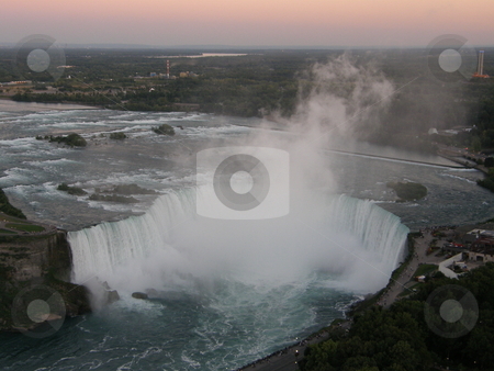 To use this stock image in your creative project, please select the size you need over to the right and click the "Add to Cart" button.
Your downloaded image will come with the Cutcaster watermark removed so don’t worry about the watermark you see on this page. Niagara Falls stock photo, Niagara Falls - border of USA by Ritu Jethani