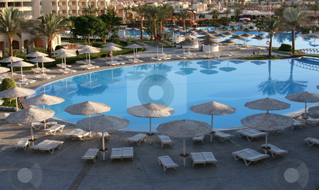 To use this stock image in your creative project, please select the size you need over to the right and click the "Add to Cart" button.
Your downloaded image will come with the Cutcaster watermark removed so don’t worry about the watermark you see on this page. Pool stock photo, A photography of a pool side view by Markus Gann