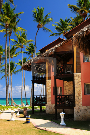 To use this stock image in your creative project, please select the size you need over to the right and click the "Add to Cart" button.
Your downloaded image will come with the Cutcaster watermark removed so don’t worry about the watermark you see on this page. Tropical resort on ocean shore stock photo, Luxury tropical resort on ocean shore with palm trees by Elena Elisseeva
