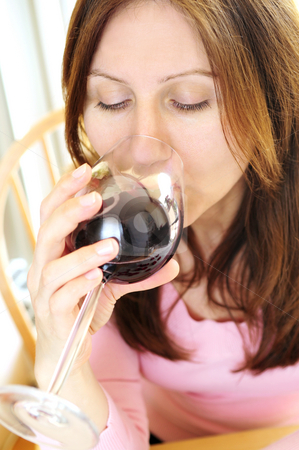 To use this stock image in your creative project, please select the size you need over to the right and click the "Add to Cart" button.
Your downloaded image will come with the Cutcaster watermark removed so don’t worry about the watermark you see on this page. Mature woman with a glass of red wine stock photo, Mature woman holding a glass of red wine by Elena Elisseeva