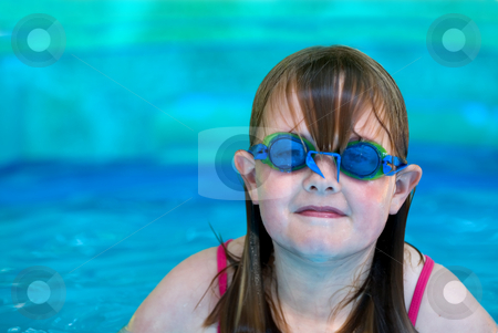 To use this stock image in your creative project, please select the size you need over to the right and click the "Add to Cart" button.
Your downloaded image will come with the Cutcaster watermark removed so don’t worry about the watermark you see on this page. Girl in pool stock photo, A young girl with swimming goggles in an inflatable pool with space on left for type by Vince Clements