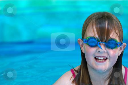 To use this stock image in your creative project, please select the size you need over to the right and click the "Add to Cart" button.
Your downloaded image will come with the Cutcaster watermark removed so don’t worry about the watermark you see on this page. Girl wearing goggles stock photo, A young girl with swimming goggles in an inflatable pool with room on right for type by Vince Clements