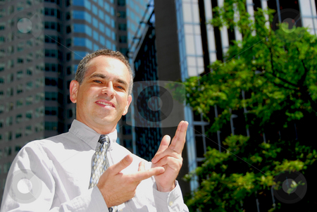 To use this stock image in your creative project, please select the size you need over to the right and click the "Add to Cart" button.
Your downloaded image will come with the Cutcaster watermark removed so don’t worry about the watermark you see on this page. Businessman explaining stock photo, Confident smiling businessman explaining a concept by Elena Elisseeva