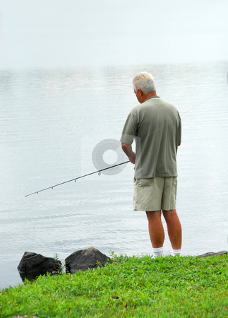 To use this stock image in your creative project, please select the size you need over to the right and click the "Add to Cart" button.
Your downloaded image will come with the Cutcaster watermark removed so don’t worry about the watermark you see on this page. Man fishing stock photo, Senior man fishing in a lake by Elena Elisseeva