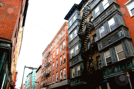 To use this stock image in your creative project, please select the size you need over to the right and click the "Add to Cart" button.
Your downloaded image will come with the Cutcaster watermark removed so don’t worry about the watermark you see on this page. Townhouses on Boston street stock photo, Narrow street in Boston historical North End by Elena Elisseeva