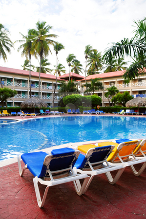 To use this stock image in your creative project, please select the size you need over to the right and click the "Add to Cart" button.
Your downloaded image will come with the Cutcaster watermark removed so don’t worry about the watermark you see on this page. Swimming pool stock photo, Swimming pool and accommodation at tropical resort by Elena Elisseeva