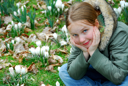 To use this stock image in your creative project, please select the size you need over to the right and click the "Add to Cart" button.
Your downloaded image will come with the Cutcaster watermark removed so don’t worry about the watermark you see on this page. Spring girl stock photo, Beautiful young girl sitting among blooming spring flowers by Elena Elisseeva