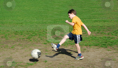 To use this stock image in your creative project, please select the size you need over to the right and click the "Add to Cart" button.
Your downloaded image will come with the Cutcaster watermark removed so don’t worry about the watermark you see on this page. Boy kicking soccer ball stock photo, Young boy kicking soccer ball by Elena Elisseeva