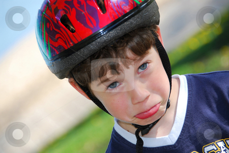 To use this stock image in your creative project, please select the size you need over to the right and click the "Add to Cart" button.
Your downloaded image will come with the Cutcaster watermark removed so don’t worry about the watermark you see on this page. Silly boy portrait stock photo, Portrait of a cute little boy in bicycle helmet making faces by Elena Elisseeva