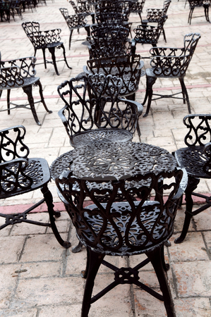 To use this stock image in your creative project, please select the size you need over to the right and click the "Add to Cart" button.
Your downloaded image will come with the Cutcaster watermark removed so don’t worry about the watermark you see on this page. Wrought iron furniture stock photo, Wrought iron furniture on the outdoor cafe patio by Elena Elisseeva
