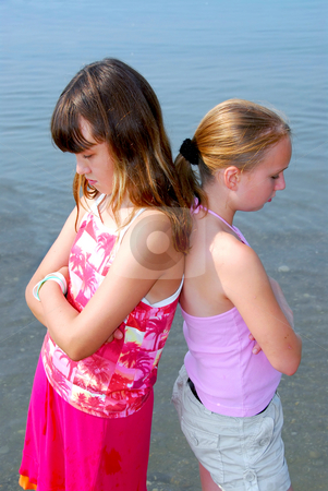 To use this stock image in your creative project, please select the size you need over to the right and click the "Add to Cart" button.
Your downloaded image will come with the Cutcaster watermark removed so don’t worry about the watermark you see on this page. Two girls pouting stock photo, Portrait of two girls pouting by Elena Elisseeva